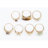 A collection of seven 9ct gold and gemstone rings, to include tigers eye, blue topaz and sapphire,