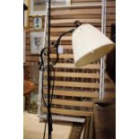 ****Ex Luddington Manor****A wrought iron scrolled standard lamp,