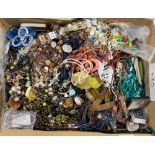 A large box of costume jewellery, including necklaces, earrings, etc.