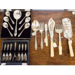 A set of Victorian style silver-plate fish servers, the tines and blade engraved with foliage,