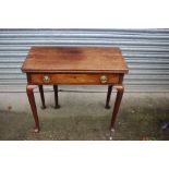 A George II mahogany fold-over card table, circa 1750, fitted with a single drawer,