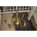 A large brass, eight branch chandelier,