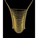 A 9ct gold necklace comprising two strands of diamond cut ball chain with a multi strand draped