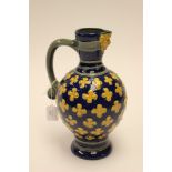 A Minton majolica ewer, German form, relief moulded with quatrefoil's and a mask spout,