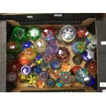 A large quantity of paperweights,