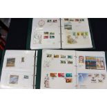 Three stamp albums containing Jersey first day covers & mint stamp packs,