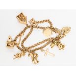 A 9ct gold double link charm bracelet, with nine charms including a squirrel,