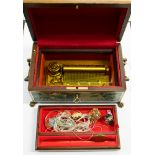 A multi tune jewellery box with key, in working order, (lift out tray to reveal mechanism, Swiss),