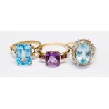 Three ladies dress rings set in 9ct gold, comprising one claw set rectangular cut blue topaz,