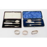 Three napkin rings and two nineteenth Century christening knife, fork and spoon sets (one af),