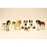 A collection of Beswick dog figures, comprising a Spaniel, Saint Bernard 'Corna Garth Stroller',