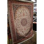 A Beige ground Keshan carpet,