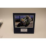 Moto GP Memorabilia: A signed Valentino Rossi action photograph, signed to top left of picture,