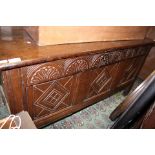 A late 17th Century oak joined chest, panelled front and lunette carved frieze,