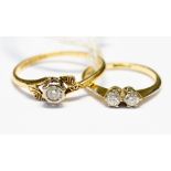 An 18ct gold and diamond solitaire ring, with fancy engraved shoulders, size T 1/2,