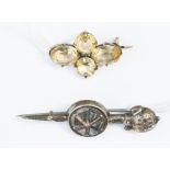 A silver brooch with four quartz stones,