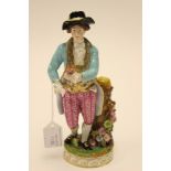 A Derby figure of a gardener,