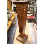 An Edwardian mahogany and satinwood cross-banded torchere of square sectioned tapering form,