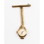 An Art Deco 9ct 'Majex' gold fob watch with T-bar pin suspending double snake chain and watch with