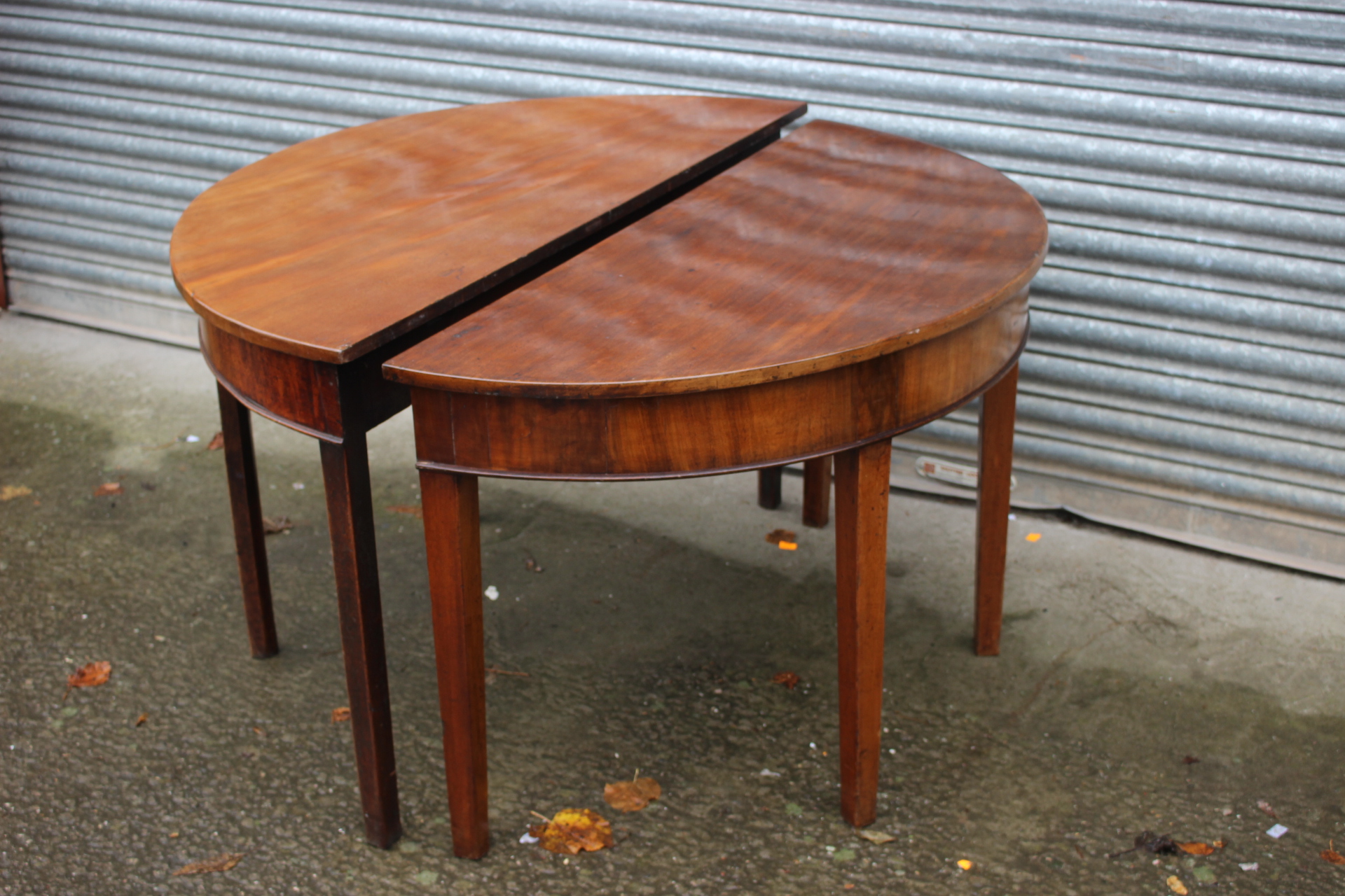 A pair of George III mahogany demi-lune tables, circa 1790, each measuring 73cm high, 122cm wide, - Image 2 of 2