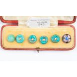 Set of five turquoise buttons each set with a central seed pearl with gold surround,