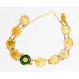 Chinese 18ct gold 'Good Luck' character bracelet, with a donut jadeite ring detail to the centre,