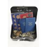 A tin of assorted coins,