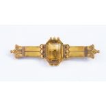 A 15ct gold double bar brooch with a rectangular cut citrine to the centre,