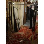 A large rectangular mirror segmented to form a mirrored frame,