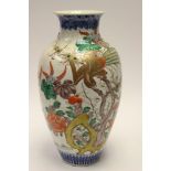 A large 19th Century baluster vase with bird and floral design,