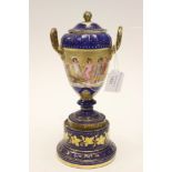 A Vienna porcelain urn and cover, raised on a porcelain plinth children playing and a deer,
