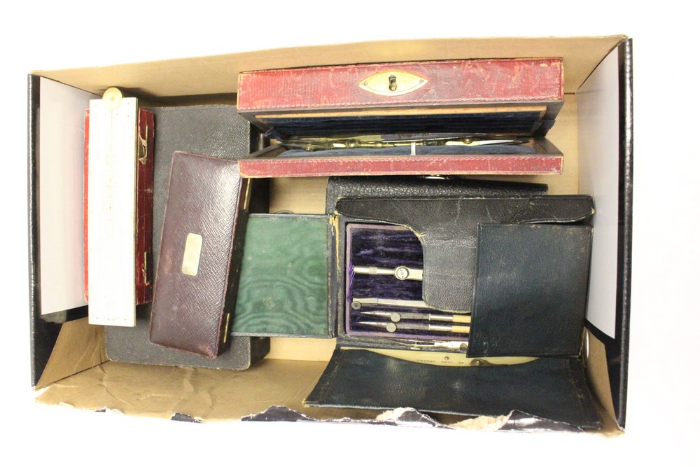A box of various cased draughtsman's drawing instruments.