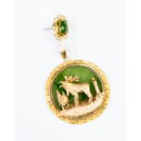 A 10ct gold North American Moose/Elk pendant with jade type stone, gross weight 9.