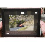 Formula 1 Memorabilia: A framed and signed photograph of Kimi Raikonnen, Ferrari action photograph,