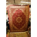 A Red ground Keshan rug,