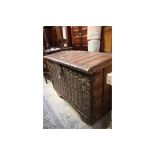 A 18th Century or later iron bound and brass studded chest,