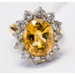 A yellow topaz and diamond cluster ring, in 18ct yellow and white gold,