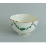 A Chelsea Derby Porcelain Tea Bowl, decorated with green swags and gilt rims Date circa 1780,