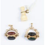 Two 9ct gold and hard stone swivel fobs, together with bone Stanhope,