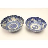 A pair of blue and white Japanese bowls with fluted rims