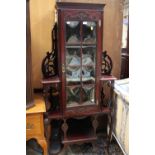 A late Victorian mahogany corner display cabinet, pierced back,