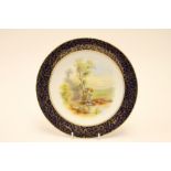 A Royal Worcester porcelain plate painted figure of girl carrying corn sheaves in landscape,