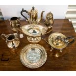 A group of silver plated wares to include a sugar coaster, hot water pot, sauce tureen, milk jug,