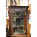 A 19th Century hanging corner cupboard,