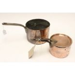 Two 19th Century copper pans, smaller with lid,