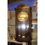 An Art Deco oak eight day wall clock,