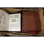 Nine stamp albums including first day covers, GB mint, RSA mint, African FDCs, etc.