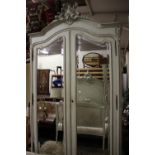 ****Ex Luddington Manor****A French painted wood double wardrobe, on cabriole supports,