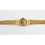 A 9ct gold ladies watch, Rotary, bark effect strap, 15.