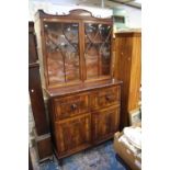 An early 19th Century mahogany secretaire bookcase, upper section with two glazed doors,